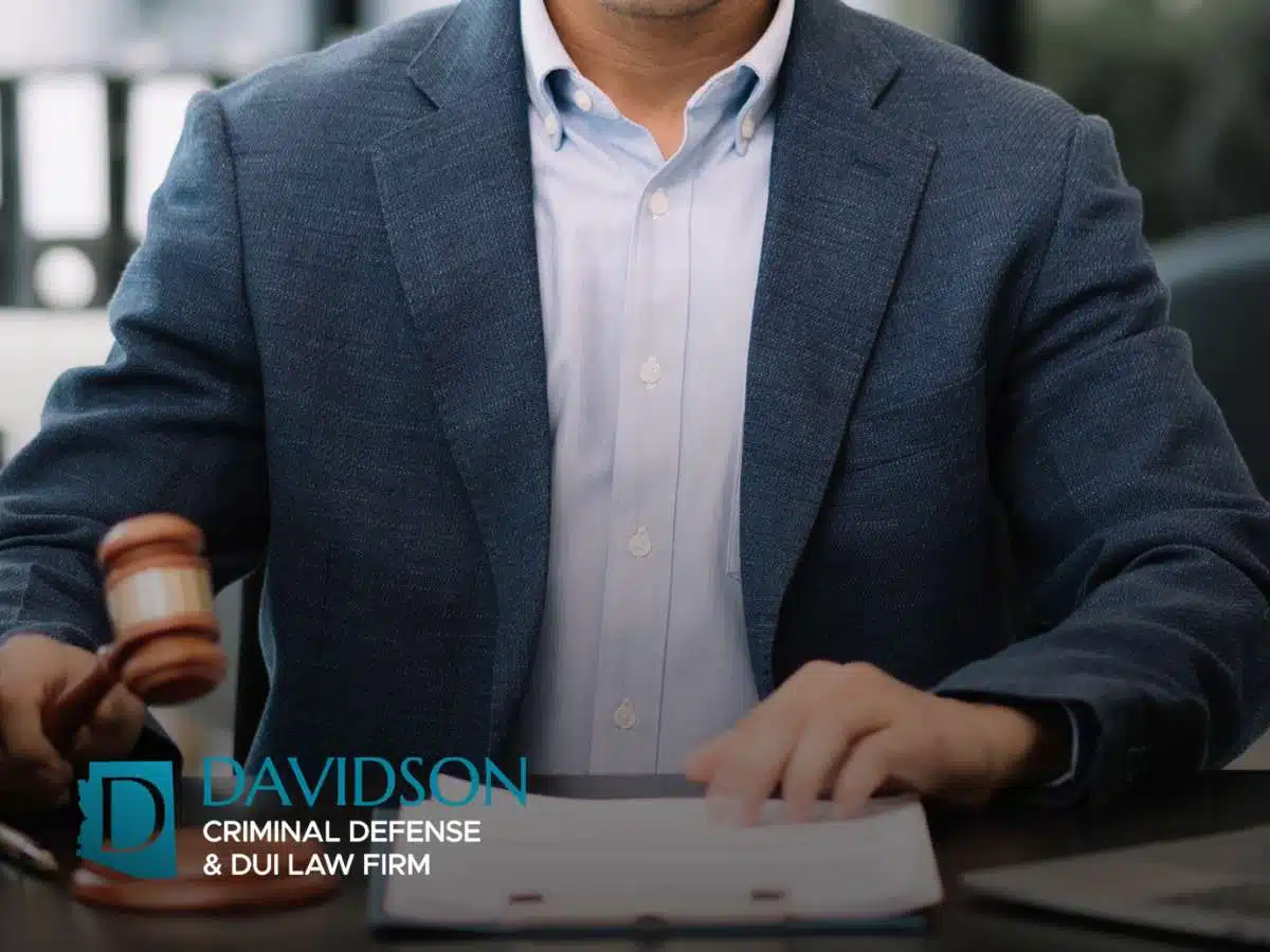 Criminal defense attorney reviewing witness statements during a case investigation